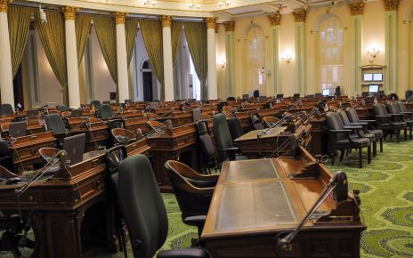 A sea of empty desks inside the California State Assembly