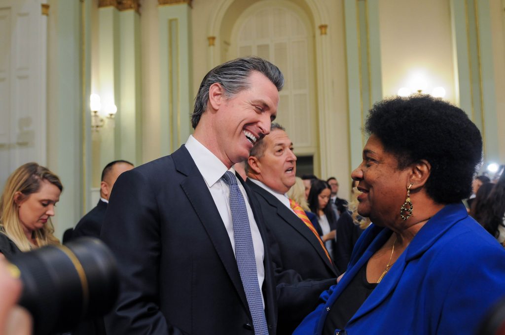 Gavin Newsom shares a laugh with Shirley Webar